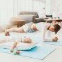 mom exercising beside sleeping baby