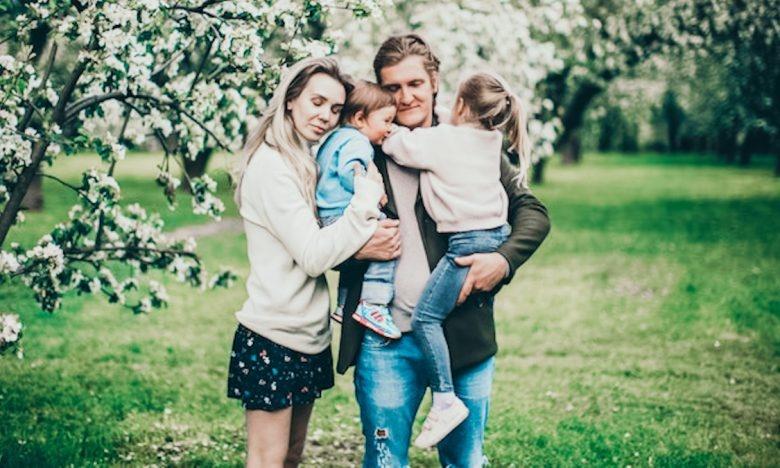 family of 3 posing for photo