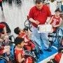 coach talking to special needs basket ball team