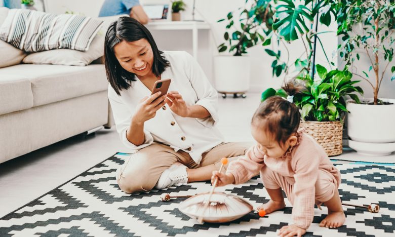 Protect your child's privacy online - mom taking photo of toddler