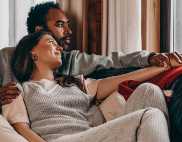 Couple snuggled on couch-mental health