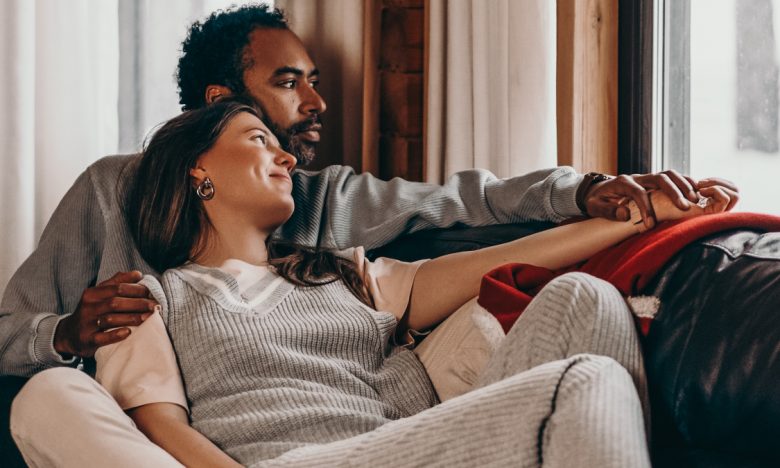 Couple snuggled on couch-mental health