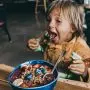 toddler eating healthy yogurt bowl