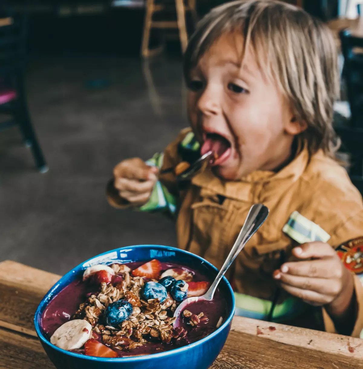 toddler eating healthy yogurt bowl