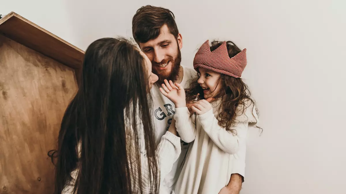 mom and dad playing with daughter wearing crochet crown