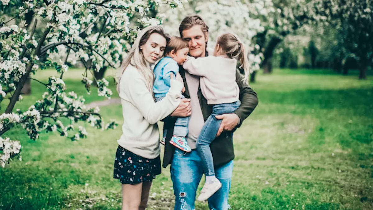 family of 3 posing for photo