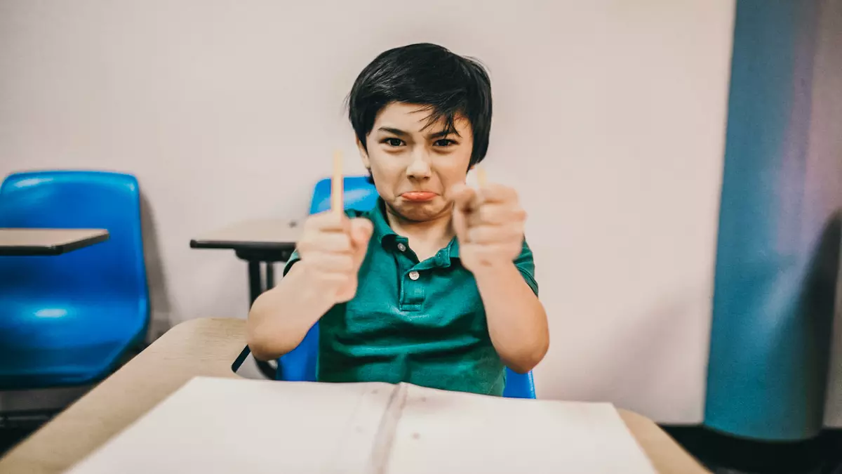 angry boy in classroom breaks pencil in half