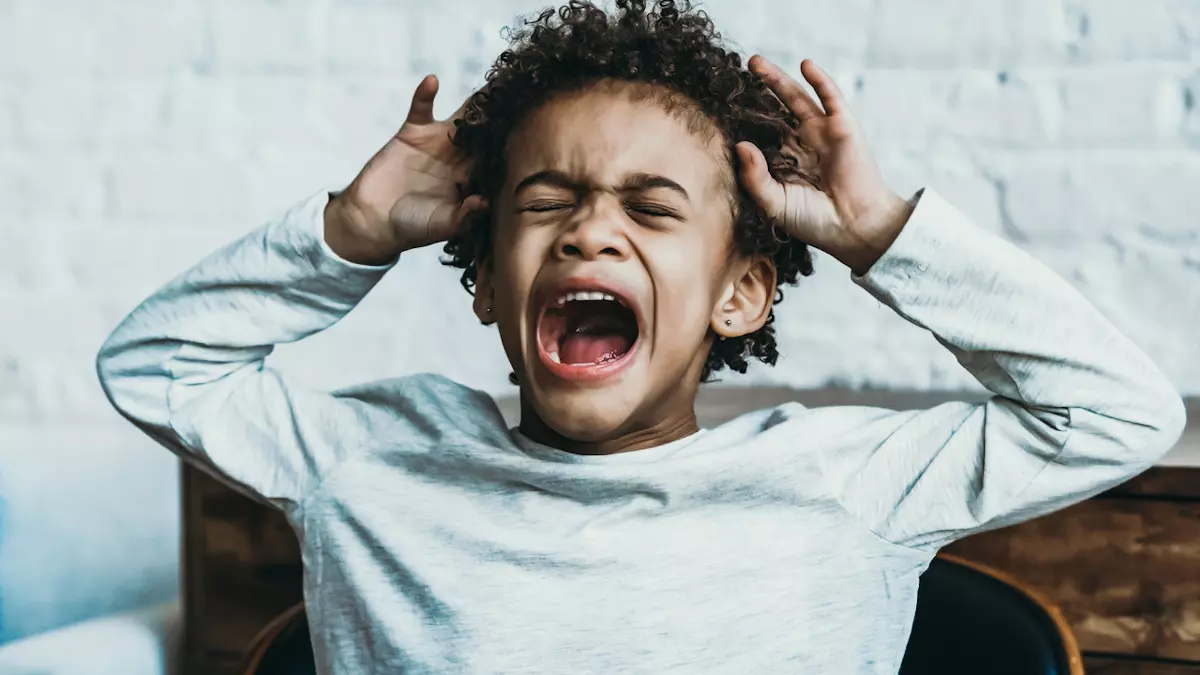 boy upset and crying in chair