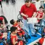 coach talking to special needs basket ball team